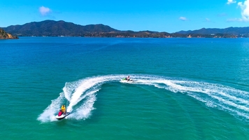 Group of jet skis exploring the Bay of Islands coastlines